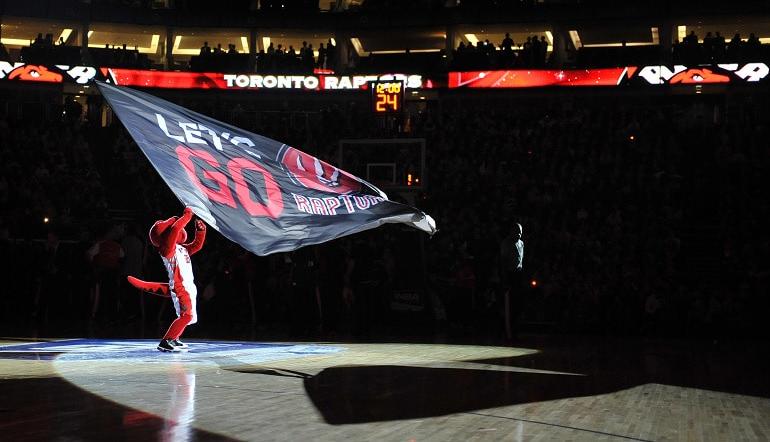 Toronto Raptors Mascot waving flag