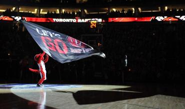 Toronto Raptors Mascot waving flag